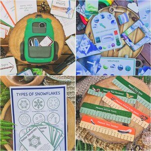 May include: A collection of nature-themed educational games and activities for kids. The games include a weather station, animal track identification cards, snowflake identification cards, and measuring tools for different objects found in nature. The games are laid out on a wooden table with a green, brown, and blue color scheme.