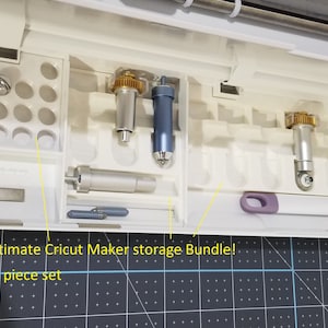 May include: A white Cricut Maker storage bundle containing crafting tools and accessories. The image displays a 3-piece set, including blades and other essentials. Text on the image reads "Ultimate Cricut Maker storage Bundle!" and "3 piece set".