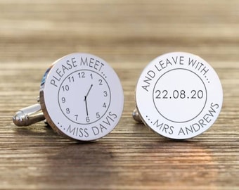May include: A pair of silver cufflinks with engraved designs. One cufflink features a clock face with the text "PLEASE MEET... MISS DAVIS" and the other cufflink features the text "AND LEAVE WITH... 22.08.20 MRS ANDREWS".