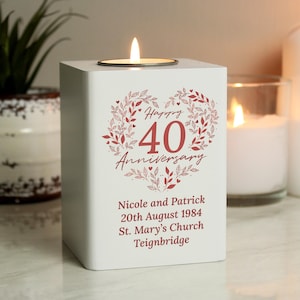 May include: White wooden tea light holder with a red heart design and the text "Happy 40th Anniversary". The text below the heart reads "Nicole and Patrick 20th August 1984 St. Mary's Church Teignbridge".