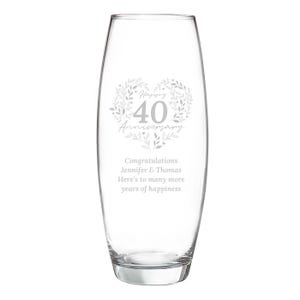 May include: A clear glass bullet-shaped vase featuring an etched design of a leafy heart surrounding the text Happy 40 Anniversary. Below the heart, the text reads Congratulations Jennifer & Thomas Here's to many more years of happiness.