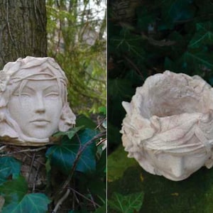 以下が含まれることがあります： 花柄の装飾が施された女性の顔の形をした白い陶器製のプランター。小さな植物や花を植えるように設計されています。