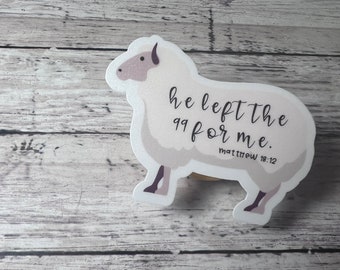 May include: White sheep cutout with the text "He left the 99 for me. Matthew 18:12" on a woodgrain background.