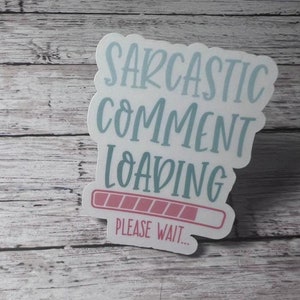 May include: A white sticker with blue and pink text that reads "Sarcastic Comment Loading..." with a progress bar underneath. The progress bar is mostly filled in with pink.