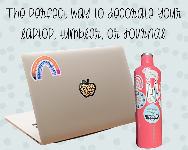 May include: A laptop and a pink water bottle are decorated with colorful stickers. The laptop has a rainbow and apple sticker. The water bottle is covered in various stickers with inspirational quotes and designs. Text on the image reads: "The perfect way to decorate your laptop, tumbler, or journal!"