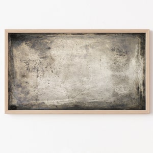 May include: A framed abstract painting with a textured, distressed, gray and brown background.