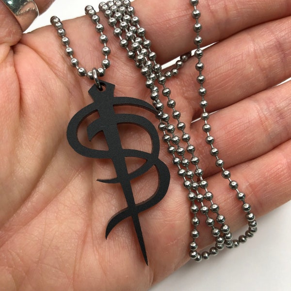 Skinny Puppy industrial music necklace - matte black acrylic