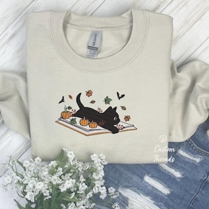 Embroidered Cute Cat Lying on Book Fall Sweatshirt Book Lover Sweatshirt Halloween Sweatshirt Embroidered Cute Cat Book Sweatshirt Cat Lover