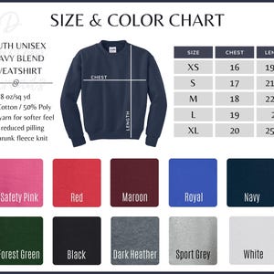 May include: A youth unisex heavy blend sweatshirt size and color chart. The chart displays a navy blue sweatshirt with chest and length measurement lines, a table with sizes XS to XL in inches, and ten color swatches: Safety Pink, Red, Maroon, Royal, Navy, Forest Green, Black, Dark Heather, Sport Grey, and White.