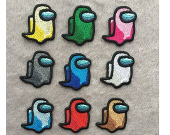 May include: Twelve embroidered iron-on patches featuring the Among Us character in different colors, including yellow, green, pink, gray, blue, white, light blue, red, brown, purple, orange, and lime green.