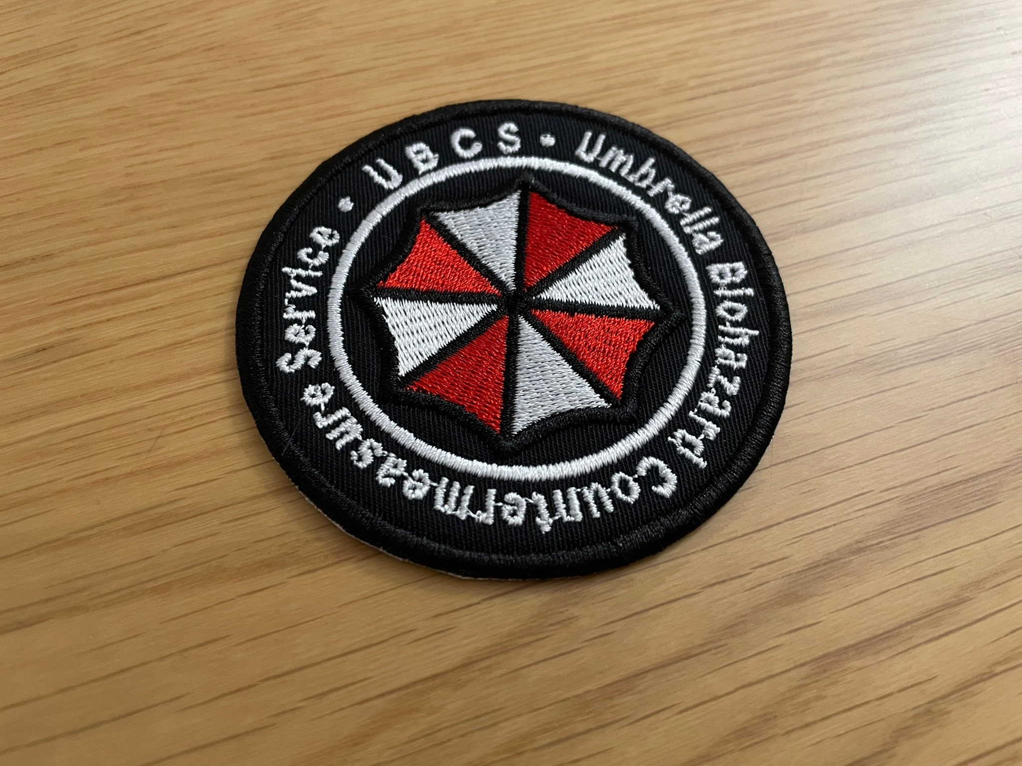 BIOHAZARD THE REAL2 U.B.C.Sバッジ il_fullxfull.5978732195_f8lm.jpg