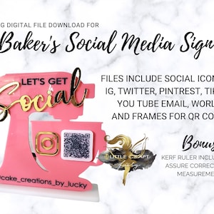 May include: A pink and gold social media sign for bakers, shaped like a mixer. The sign includes the text "Let's Get Social" and social media icons. The sign also includes a QR code and the text "@cake_creations_by_lucky".