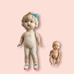 Vintage porcelain cutie doll and baby doll 1940s