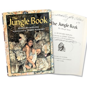 May include: The Jungle Book by Rudyard Kipling, illustrated by Jerry Pinkney. The cover features a colorful illustration of Mowgli surrounded by wolves.