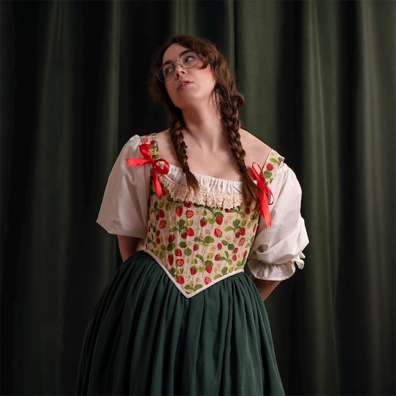 strawberry corset dress The Strawberry chiffon dress is actually a redesign of one of our 2023 pieces and honestly she grew up so beautifully Corset front, puff sleeves, layers of flowy chiffon, dark green