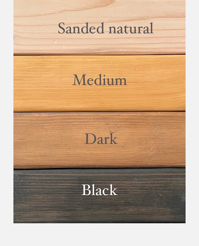 May include: A vertical image showcasing four wood stain color options: Sanded natural, Medium, Dark, and Black. Each color is displayed on a horizontal wooden plank, with the color name printed above. The wood grain is visible in each sample.