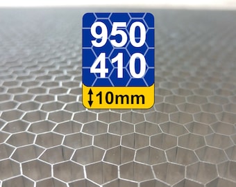May include: A close-up of a silver honeycomb panel with a blue and yellow label that reads "950 410 10mm".