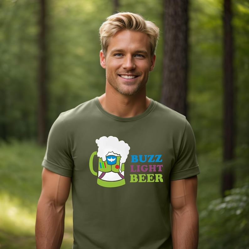 May include: A green t-shirt featuring a cartoon image of a beer stein with the text "Buzz Light Beer" in colourful letters.