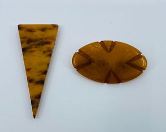 Vintage hand carved butterscotch bakelite dress clip / pin.