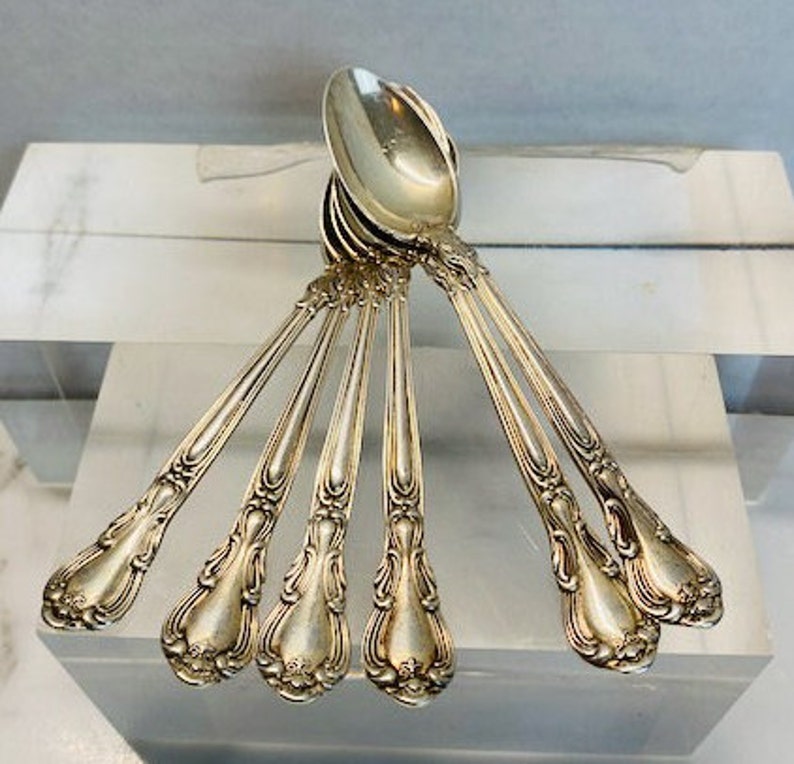 6 Vintage stamped sterling silver demitasse spoons.
