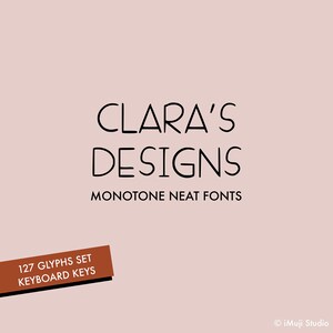 Puede incluir: Logotipo de Clara's Designs con el texto "Clara's Designs" en negro, con el lema "Monotone Neat Fonts" debajo. Un rectángulo marrón con el texto "127 Glyphs Set Keyboard Keys" se encuentra en la esquina inferior izquierda.