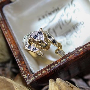 Diamond and sapphire panther ring, 9ct gold