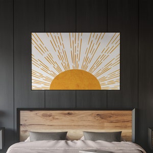 Puede incluir: Una impresi&oacute;n de arte de pared minimalista con un sol estilizado con rayos amarillos sobre un fondo blanco.