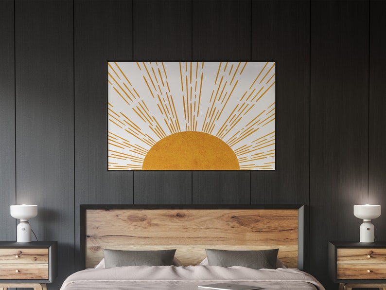 Puede incluir: Una impresi&oacute;n de arte de pared minimalista con un sol estilizado con rayos amarillos sobre un fondo blanco.