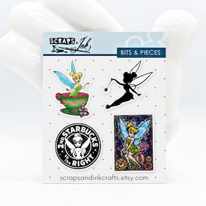 May include: A sheet of Bits & Pieces stickers featuring Tinkerbell designs. Includes a silhouette, a stained-glass style image, and a Starbucks parody. The stickers are in various colors, including green, pink, and black. The website scrapsandinkcrafts.etsy.com is printed at the bottom.