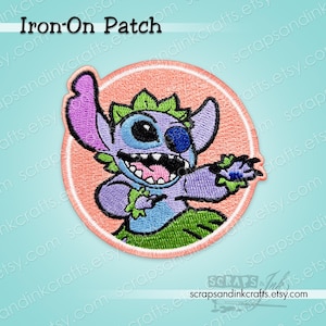 May include: An iron-on patch featuring a cartoon character with purple, blue, and green details. The character is inside a peach-colored circle, with the words "Iron-On Patch" at the top. The patch has a stitched design.