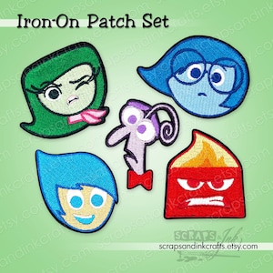 May include: An iron-on patch set featuring five embroidered character designs from the movie "Inside Out." The patches include Joy, Sadness, Anger, Fear, and Disgust, each with distinct colors and expressions. The text "Iron-On Patch Set" is at the top.