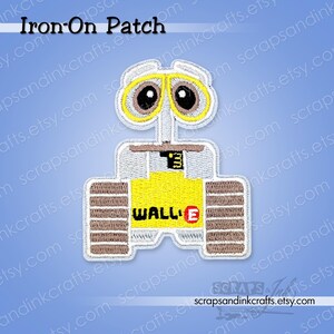 May include: Embroidered iron-on patch featuring the WALL-E robot character. The patch has a yellow, brown, and white color scheme, with the word "WALL-E" in black and red. The patch is designed for application on fabric items.