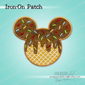 May include: An iron-on patch in the shape of Mickey Mouse's head, designed to resemble a waffle cone with chocolate and colorful sprinkles. The patch has a light blue background and the text "Iron-On Patch".