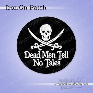 May include: Black, round iron-on patch featuring a skull and crossbones design with the text "Dead Men Tell No Tales" in white. The patch is a pirate-themed accessory, perfect for adding to clothing or bags.
