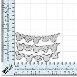 May include: Metal die cut for crafting featuring a Mickey Mouse themed banner with three rows of Mickey Mouse heads, hands, and a simple design. The die cut is approximately 4 inches wide and 2 inches tall.