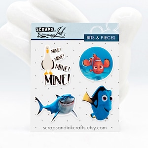 BUSCANDO A NEMO Juego de 4 adornos acrílicos para manualidades, álbumes de recortes, tarjetas, accesorios para el cabello, regalos y decoración del hogar con temática de Disney- 41002