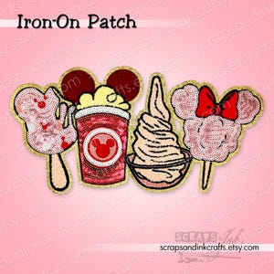 May include: Four iron-on patches with gold glitter edging. Designs include a Mickey Mouse ice cream bar, a red cup with a Mickey Mouse logo, a soft-serve ice cream, and a cotton candy Mickey Mouse head with a red bow. The text "Iron-On Patch" is at the top.
