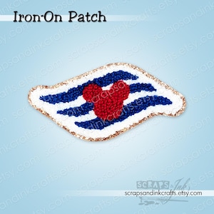 May include: An iron-on patch with a red heart-shaped Mickey Mouse design, set against blue and white stripes. The patch has a gold border and the text "Iron-On Patch" at the top. Ideal for clothing or accessories.
