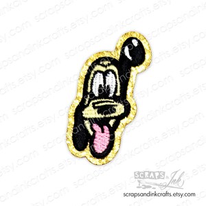 May include: A gold embroidered iron-on patch featuring a cartoon dog with a pink tongue sticking out. The dog is wearing a black and white outline.