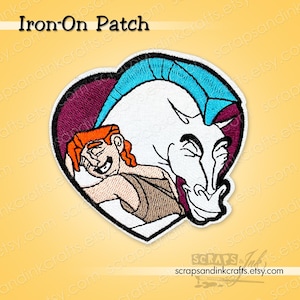 May include: Embroidered iron-on patch featuring Hercules and Pegasus in a heart shape. The patch has a white background with blue, red, and brown accents. The text "Iron-On Patch" is at the top. The Etsy shop name is at the bottom.