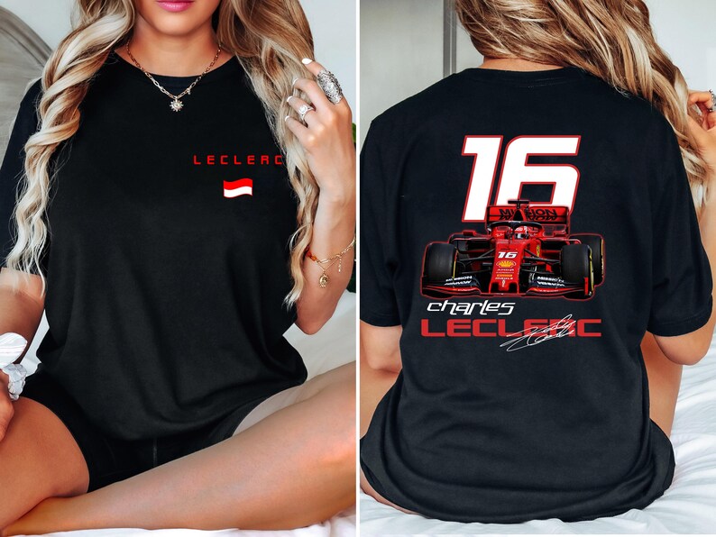 May include: Black t-shirt with a red and white race car graphic and the text "Charles Leclerc" and "16".