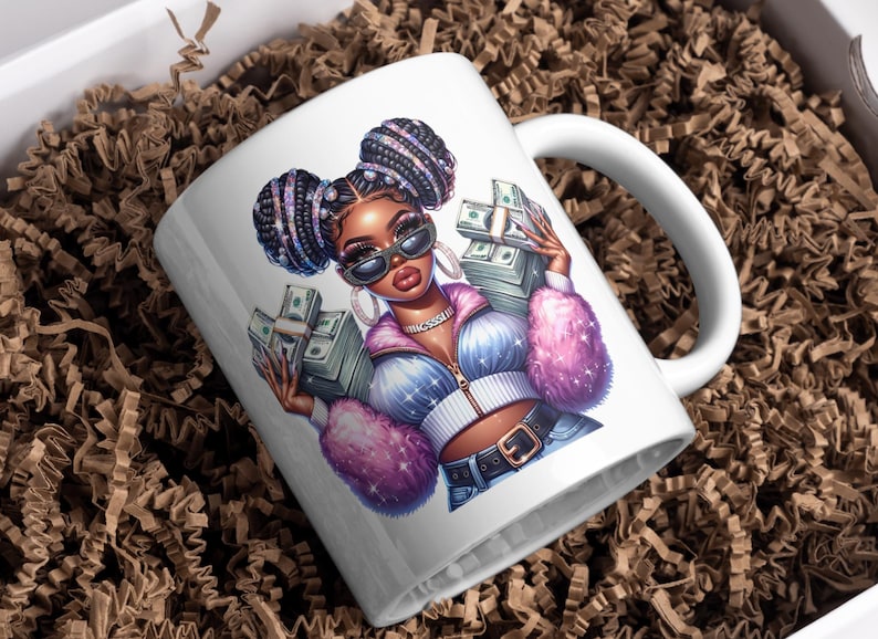May include: White ceramic mug with a colorful illustration of a woman with braids holding stacks of money. The woman is wearing a pink and blue jacket and jeans.