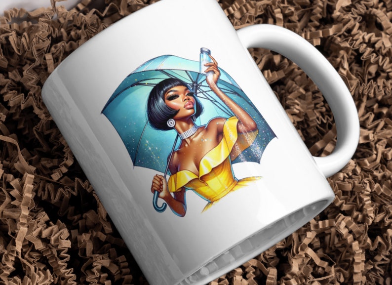 May include: White ceramic mug featuring a colourful illustration of a woman holding an umbrella and a bottle. The woman is wearing a yellow dress and has black hair. The umbrella is blue and has a white handle.