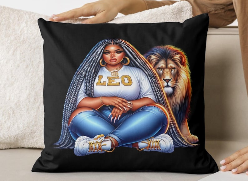May include: Black cushion featuring a digital illustration of a person with long braided hair, wearing a white t-shirt with "LEO" text, blue jeans, and white trainers. A lion is behind the person. The cushion is a decorative item.