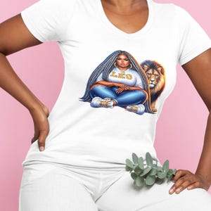 May include: White v-neck t-shirt with a graphic of a person with long grey hair, blue jeans, and trainers, with the word "LEO" on the shirt. A lion is next to the person.