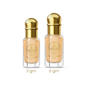 May include: Two perfume bottles with gold lids and labels. The bottles are clear, with a light peach-coloured liquid inside. The labels read "ROYAL ARON HOUSE CANADA" and "Scent Of Regally." One bottle is labeled "3 gm" and the other "6 gm."