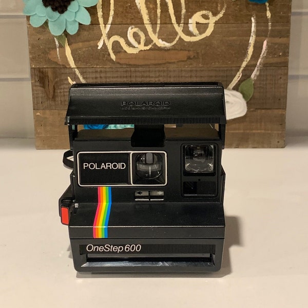 This is a Fantastic OneStep 600 Polaroid Camera with a Rainbow Stripe