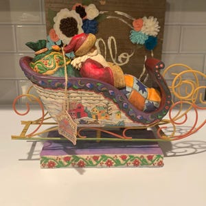 Jim Shore Figurine | Jim Shore Santa Delivering Joy | Collectable Jim Shore Statue | Jim Shore Santa on a Sled