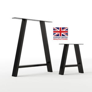 May include: Two black metal table legs in an A-frame shape. The legs are made of sturdy metal and are designed to support a tabletop. The legs are shown in two different sizes.