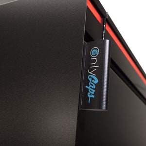 May include: A black computer case with a red stripe and a black tag hanging from it. The tag has the text "onlyGaps" in blue and white.